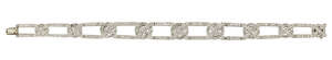 
	
		A diamond flexible bracelet, of circular-cut diamond openwork links with graduated...