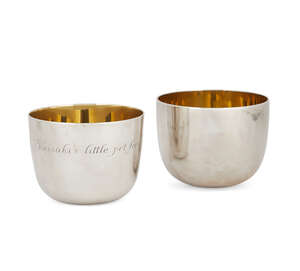 A pair of silver tumblers with gilt wash interiors, London c.1972, one Garrard & Co., the other CJ Vander Ltd., both with personalised engraving, one to base, 