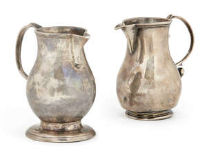 A George II silver sparrow beak cream jug, London c.1726, William Atkinson, 7.5cm high, together with another similar, Chester c.1799, approx 5.5oz (2)