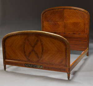 
	
		A tulip wood, burr walnut, and gilt metal mounted double bed, mid 20th Century, the...