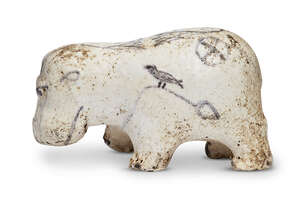 
	
		An Egyptian white glazed painted limestone hippopotamus, Middle Kingdom, circa...