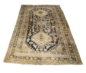
	
		A Qashqai rug, with three step edged medallions, birds and lozenge motifs in deep blue...