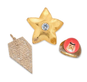 Three items of jewellery,&nbsp;comprising an Islamic pendant of textured kite shaped design with...