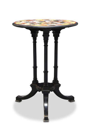 
	
		An Italian specimen marble circular table top, late 19th century, on an ebonised wood...