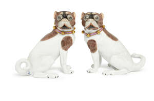 
	
		A pair of Dresden porcelain models of pugs, 20th century, modelled seated on their...