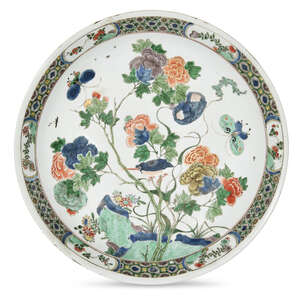 
	
		A large Chinese porcelain dish, Kangxi period, painted in famille verte enamels with a...