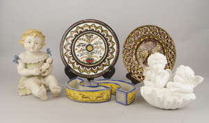A Copeland porcelain wall mounted pocket, late 19th/early 20th century, inspired by a design by Michelangelo, 20cm high, together with a German model of a chil