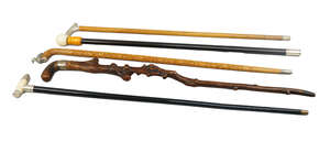 
	
		An ivory and silver mounted walking cane, marks for HP Birmingham 1900, with an ebonised...