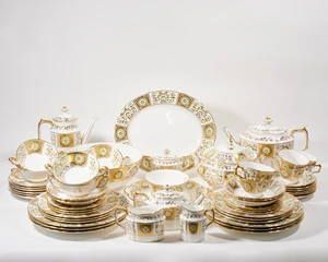 A Royal Crown Derby porcelain 'Green Derby Panel' pattern dinner, tea and coffee service, last...
