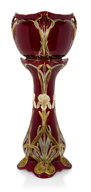 
	
		An Art Nouveau ceramic jardinière and stand 
		c.1900 
		The jardinière moulded with...