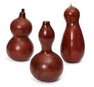 
	
		A group of three Chinese gourd vessels, Qing dynasty, with bone and hardwood stoppers,...