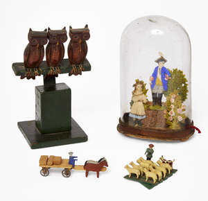 
	
		A painted pine Folk Art group of three owls, late 19th/early 20th century, on a...