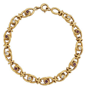 
	
		A ruby and diamond bracelet comprising knotted links and alternating intervals of...