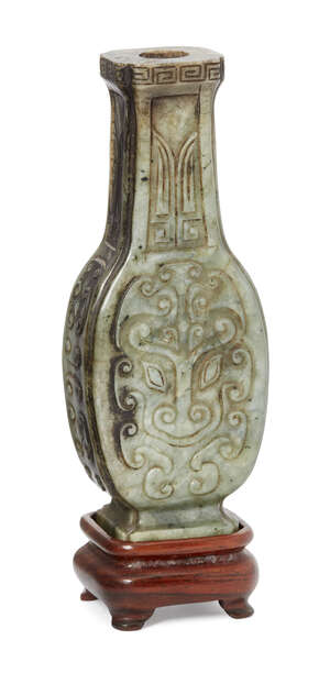 
	
		A Chinese archaistic hardstone vase, early 20th century, carved in low relief to the...