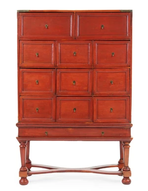 A Chinese red-lacquered two-part cabinet, late 18th / 19th century, with an arrangement of...