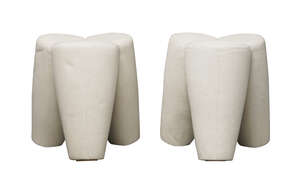 
	
		A pair of contemporary tripod stools, 
		c.2010,
		Upholstered in cream woollen fabric,...
