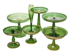 
	
		A  Victorian green glass epergne, with a single horn, overall decorated with Greek key...