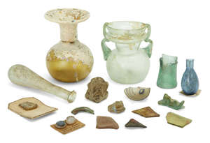 
	
		Four Roman glass vessels 
		Circa 1st-4th Century A.D.  
		Two glass unguentaria, one...
