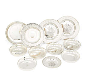 Four silver Armada dishes, two London, c.1970, CJ Vander Ltd., the bases with repousse ship design, 12cm dia., one London, c.1973, Asprey & Co., 11.5cm dia., a