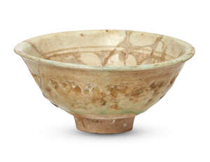 
	
		An Iranian bowl, covered with a greenish white glaze, decorated with a band of...