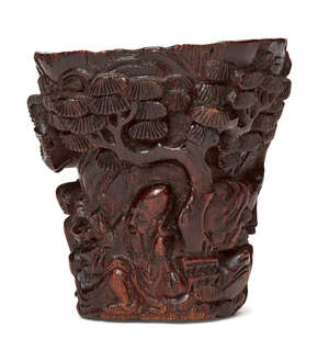 
	
		A Chinese chenxiangmu libation cup, 16th/17th century, of tapered form carved to the...