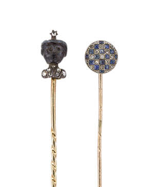 
	
		Two diamond and gem stickpins, the first a late 19th century, onyx and rose-cut diamond...