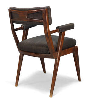
	
		Italian, a stained beech armchair, in the manner of Osvaldo Borsani  
		c.1950  
		With...