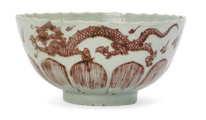 
	
		A Chinese porcelain lotus-moulded celadon glazed 'dragon' bowl, Kangxi period, painted in...