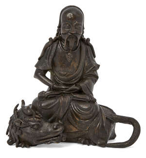 
	
		A Chinese bronze figure of a deity atop a quilong dragon, Ming dynasty, 17th century, the...