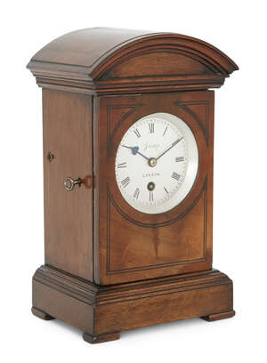 
	
		A mahogany mantel timepiece, late 19th/early 20th century, the case with arched moulded...