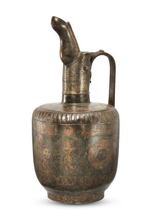 
	
		A large unusual Khorasan copper inlaid bronze ewer, Iran, 12th-13th century, with...
