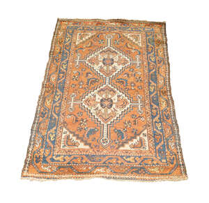 
	
		A Hamadan rug, North West Persia, c.1930, the terracotta field with two ivory medallions,...