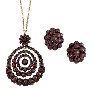 
	
		A 19th century suite of garnet jewellery, comprising: a faceted  garnet pendant designed...