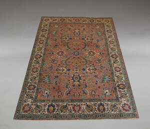 
	
		A Tabriz carpet, with all over design in brick red field, the ivory border flanked by...