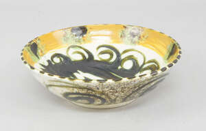 Bill and Maggie Fisher, circa. 1970's, a Cornish Celtic pottery bowl in the 'Folksey Pattern' from the Mousehole pottery, 20cm diameter