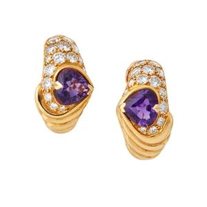Kutchinsky. A pair of purple sapphire and diamond earclips, each set with a heart-shaped purple...
