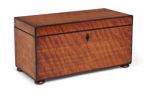 
	
		A George III satinwood two-division tea caddy, the interior lid with parquetry decoration...