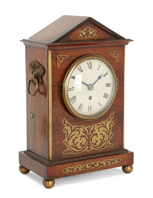 
	
		A rosewood and brass inlaid mantel clock, early 19th century, the architectural rosewood...