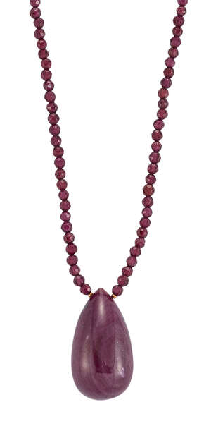 
	
		A ruby and garnet necklace, the pear-shaped ruby bead drop measuring 29.0 x 16.0 x 16.1mm...