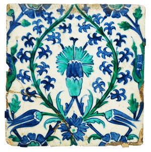 
	
		An Iznik pottery tile, Ottoman Turkey, 17th century, painted in blue, turquoise and green...