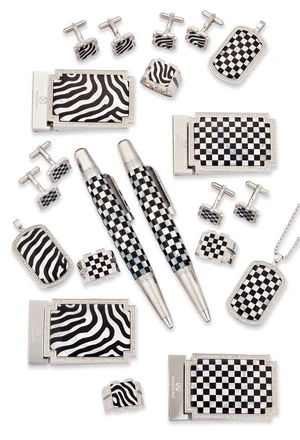 Technocrat. Four stainless steel accessories sets, the first comprising a belt buckle, pendant...