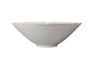 A Chinese porcelain qingbai glazed bowl, Song dynasty, 12th century, with six-petal moulded rim, unglazed, recessed base, 20cm diameter, 6.5cm high
		 
		Pr