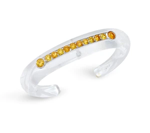 A rock crystal and yellow diamond bangle, the carved rock crystal torque bangle with applied collet channel-set with a row of brilliant-cut yellow diamonds, wi