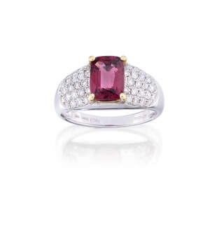 
	
		A spinel and diamond ring, the rectangular cushion-shaped spinel, weighing approximately...