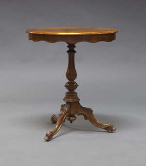 
	
		A Victorian mahogany occasional table, the oval top above shaped frieze on baluster...