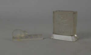 A Lalique style rectangular vase, moulded to both sides with a fairy, bearing the signature for Lalique, 8.5cm high