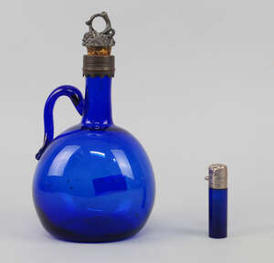 A Bristol blue glass decanter, 18th century, 24cm high, and a silver topped blue glass scent bottle (2)