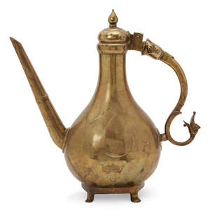 
	
		A unusually large cast brass lidded ewer, Mughal India, 18th century, the pear-shaped...