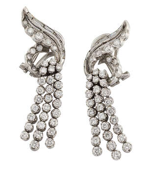 
	
		A pair of diamond ear clips, of stylised cluster scroll design with graduating rows of...