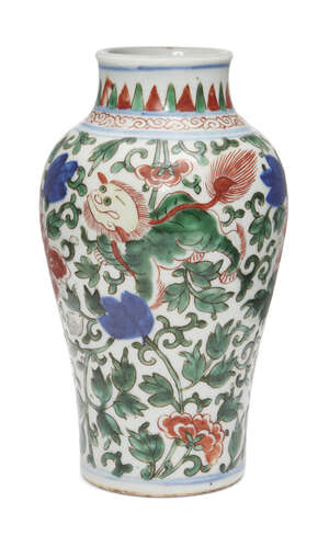 
	
		A Chinese porcelain wucai baluster vase, 17th century, painted with mythical beasts...